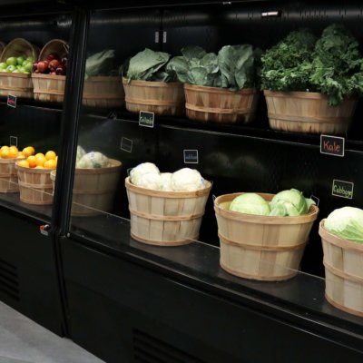 Photo: Grocery Shelves With Baskets Of Fruits And Vegtables